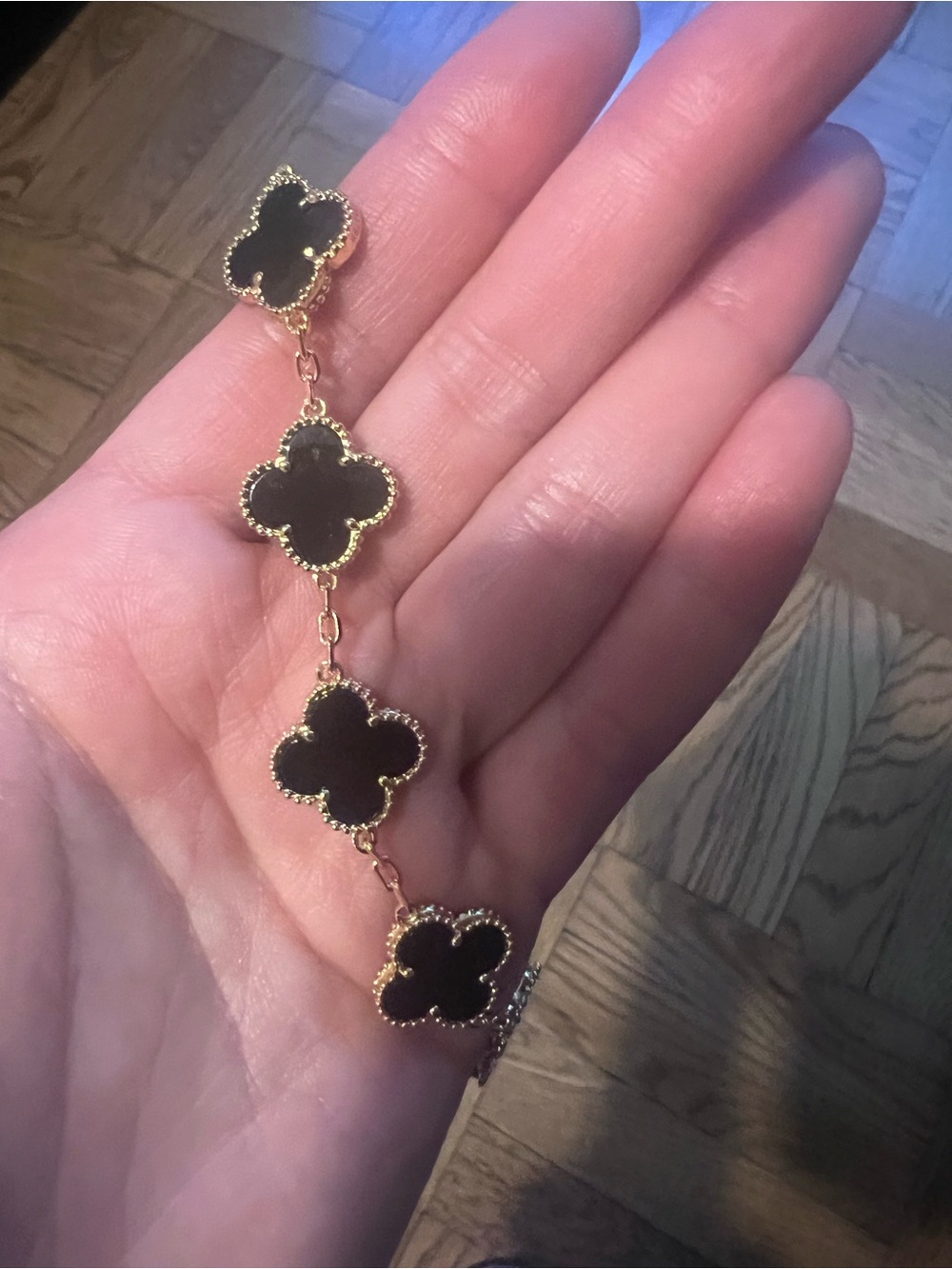 Gold Bracelet with Black Clover Motifs - Elegant Women's Jewelry